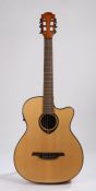 LAG Tramontane TN66ACE electro acoustic Auditorium Guitar, single cutaway.