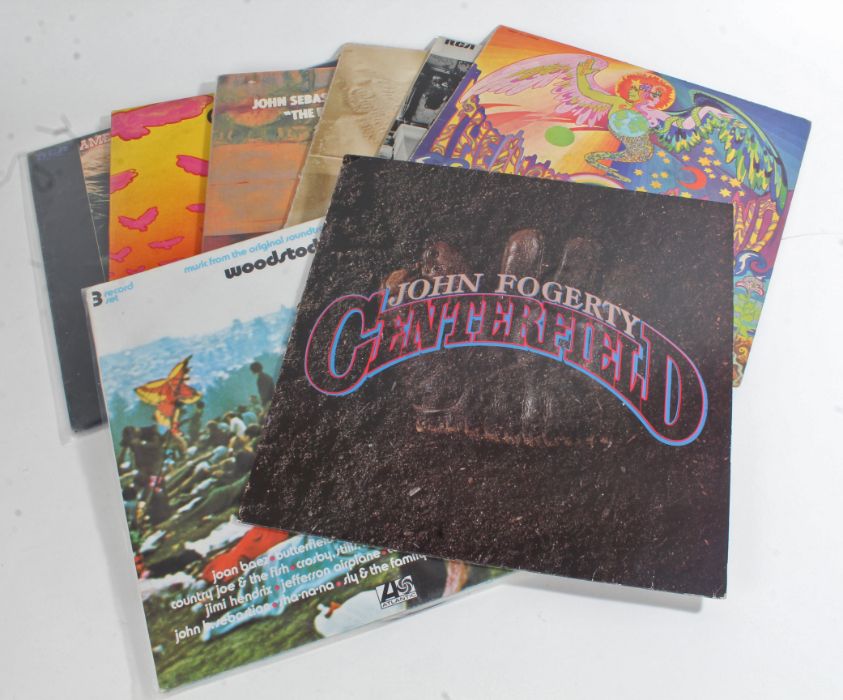 8 x Rock LPs. John Fogerty - Centerfield (925 203-1). Jerry Garcia - Garcia (RX 59301). The Guess