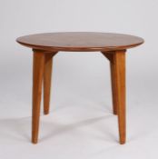 Gordon Russell circular table, the circular top with four tapering legs, the underside with a