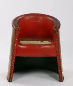 Clarks Shoe shop chair, the red leather with impressed Clarks in gilt lettering with a tub back