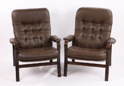 Near pair of mid 20th Century armchairs, the brown buttoned leatherette backs and seats flanked by