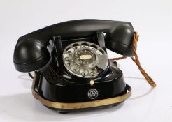 Bell Telephone company, FTTR, with a Bakelite receiver above the black and gilt decorated body