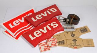 Collection of Levi's advertising materials, to include two red wood signs, two window display