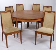 G-Plan teak circular extending dining table and six chairs, the table with central cantilever