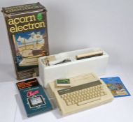 Acorn Electron computer, housed in original box, together with Tree of Knowledge, Chess and Super