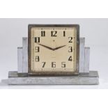 Art Deco desk clock, Swiss made, in chrome with a swivel dial and Arabic hours flanked by stepped