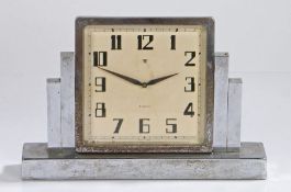 Art Deco desk clock, Swiss made, in chrome with a swivel dial and Arabic hours flanked by stepped