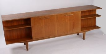 Mid 20th Century teak sideboard, with two central fall-front cupboards opening to reveal interior