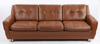 Skipper brown leather upholster three seat settee, with buttoned back and seat cushions, raised on