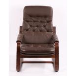 Mid 20th Century armchair, the brown buttoned leatherette back and seat flanked by padded arms, on