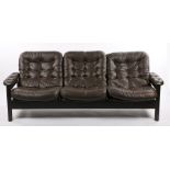 Thame three seat settee, with brown buttoned back back and seat cushions, on a dark stained show-