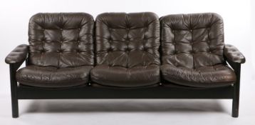 Thame three seat settee, with brown buttoned back back and seat cushions, on a dark stained show-