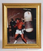 Muhammed Ali signed photograph, including COA, housed within a gilt and glazed frame, the photograph