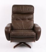 Mid 20th Century rotating armchair, the brown leatherette back and seat flanked by padded arms, on a