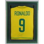 Ronaldo, signed and framed Brazil shirt, lacking COA, housed within a green and glazed frame, 43cm