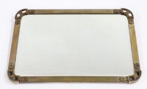 Early 20th Century brass framed wall mirror, the bevelled mirror plate housed in a brass frame