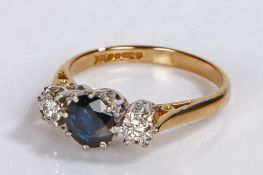 18 carat gold sapphire and diamond set ring, the central sapphire flanked by a diamond to either