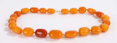Butterscotch amber necklace, with a row of graduated beads, the largest bead approximately 31mm
