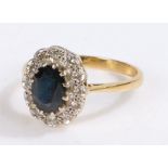 18 carat gold sapphire and diamond set ring, with a central sapphire and diamonds surrounding, 3.7