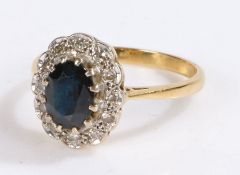 18 carat gold sapphire and diamond set ring, with a central sapphire and diamonds surrounding, 3.7