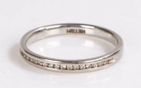 Platinum and diamond set band, with a row of diamonds to the front of the ring, 2.8 grams, ring size