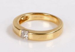 18 carat gold diamond set ring, with a princess cut diamond sunk into the shank, 5.1 grams, ring