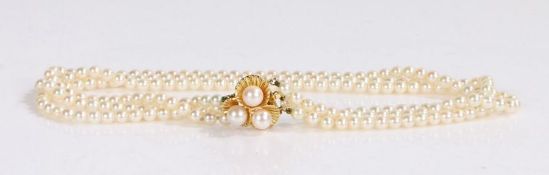 14 carat gold and pearl necklace, the gold clasp set with three pearls attached to the three