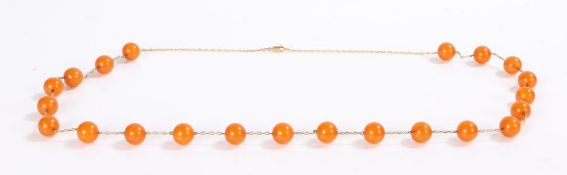 9 carat gold mounted necklace, set with reformed amber beads, 76.5cm long
