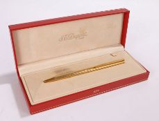 S.T. Dupont ballpoint pen, the slender gold plated pen with reeded body, boxed