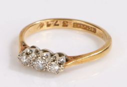 18 carat gold and diamond set ring, set with a row of three diamonds, 2.4 grams, ring size M