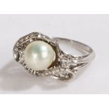 14 carat white gold pearl and diamond set ring, the raised pearl at 8mm in diameter above the