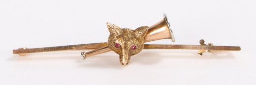 9 carat gold hunting brooch, with a foxes head set with rubies for eyes and a hunting horn behind