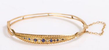 Victorian 9 carat gold sapphire and pearl set bracelet, the head of the bracelet set with a row of