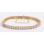 9 carat gold diamond set tennis bracelet, the white and yellow gold bracelet set with 2 carats in