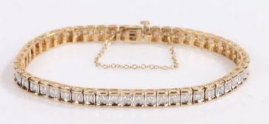 9 carat gold diamond set tennis bracelet, the white and yellow gold bracelet set with 2 carats in