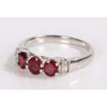 9 carat gold garnet set ring, with three oval garnets to the head, 3.2 grams, ring size P