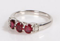 9 carat gold garnet set ring, with three oval garnets to the head, 3.2 grams, ring size P