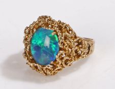 9 carat gold opal set ring, the doublet opal housed within a wriggle design head, 6.3 grams, ring