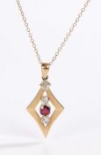 9 carat gold diamond and garnet pendant necklace, the diamond shaped pendant with a central garnet