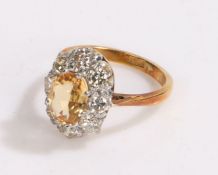 18 carat gold yellow citrine and diamond set ring, the central citrine with a ten diamond