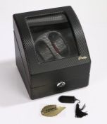 Pateker two watch winder, the carbon fibre effect case with curved perspex front panel, the interior