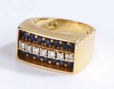 18 carat gold diamond and sapphire set ring, the rectangular head set with seven diamonds and