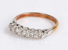 18 carat gold diamond set ring, with five round cut diamonds to the head, 2.8 grams, ring size M 1/