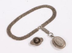 Silver locket, the oval locket with a buckle engraving attached to the wide necklace and twin loops,