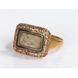 George III mourning ring, the woven hair panel head with black enamel edge and flower head surround,