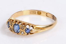 18 carat gold sapphire and diamond set ring, three sapphires flank four diamonds,2.3 grams,  ring