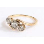 18 carat gold and diamond set crossover ring, with three diamonds to the head, 2.7 grams, ring