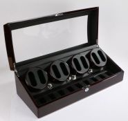 Dukwin eight watch winder, the hinged curved glazed lid opening two reveal four rotating watch