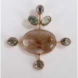 Yellow metal and rutile set pendant, the oval stone with rutile inclusions with a projected gem