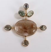 Yellow metal and rutile set pendant, the oval stone with rutile inclusions with a projected gem